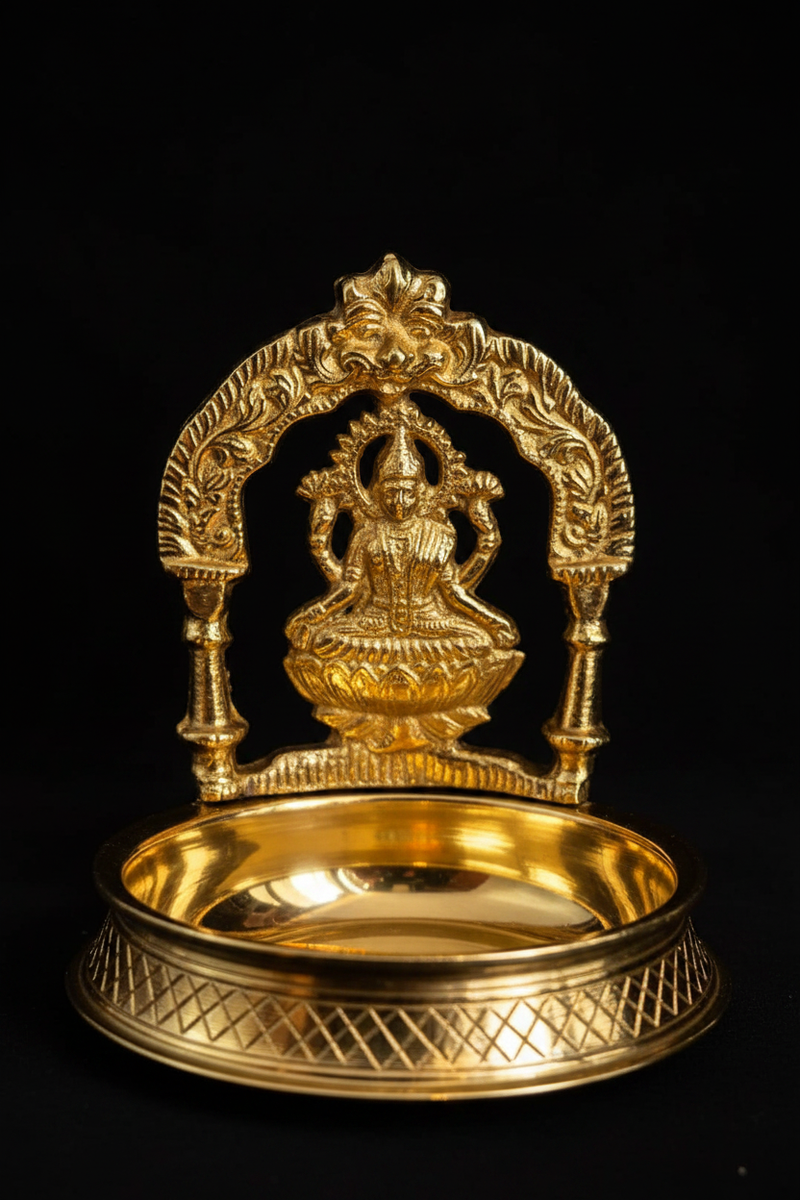 Lakshmi diya on black background with dramatic lighting