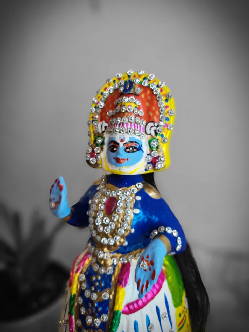 Tanjore Vishnu doll close-up face and crown