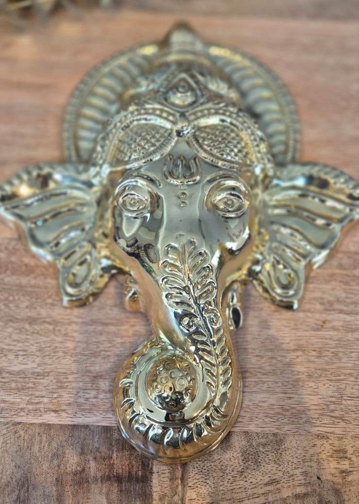 Ganesha Mukham small brass face wall plaque close-up