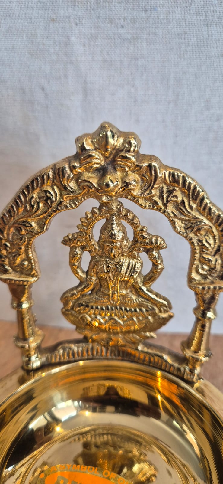 Lakshmi diya brass oil lamp Goddess Lakshmi arch close-up