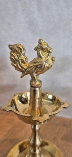 Mayil Vilakku brass peacock diya close-up
