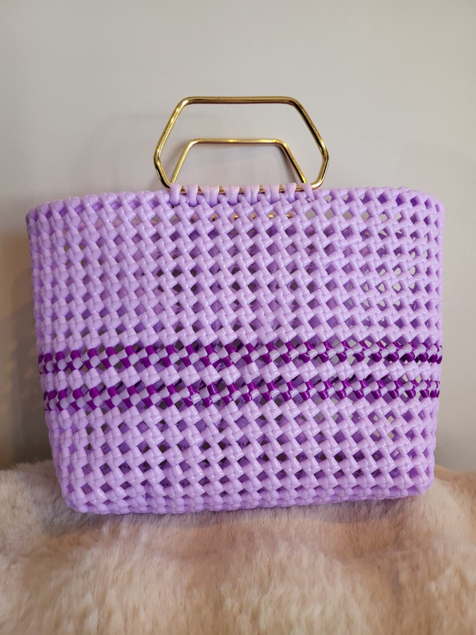 Handwoven lavender basket bag front view with gold geometric handle