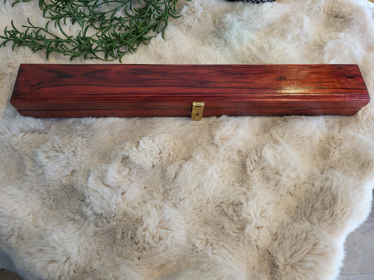 Pallanguzhi large board closed top-down view showing wood grain and brass latch