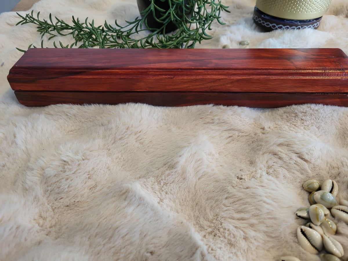 Mancala board top-down view with cowrie shells