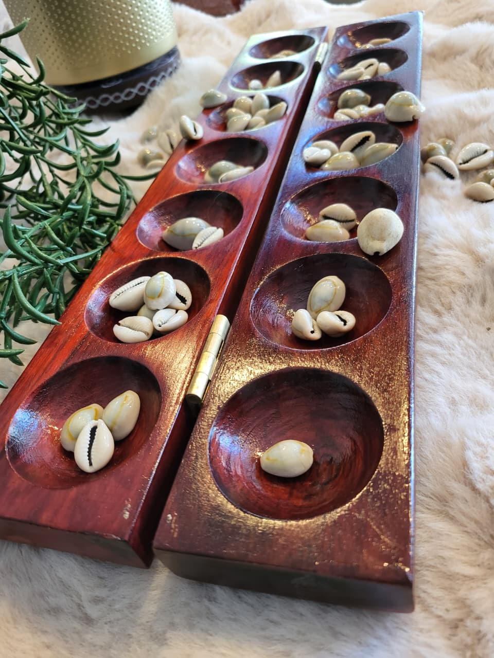 Mancala board open showing empty pits