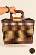 Front view of brown-gold handwoven market bag with wooden handles and white accent band