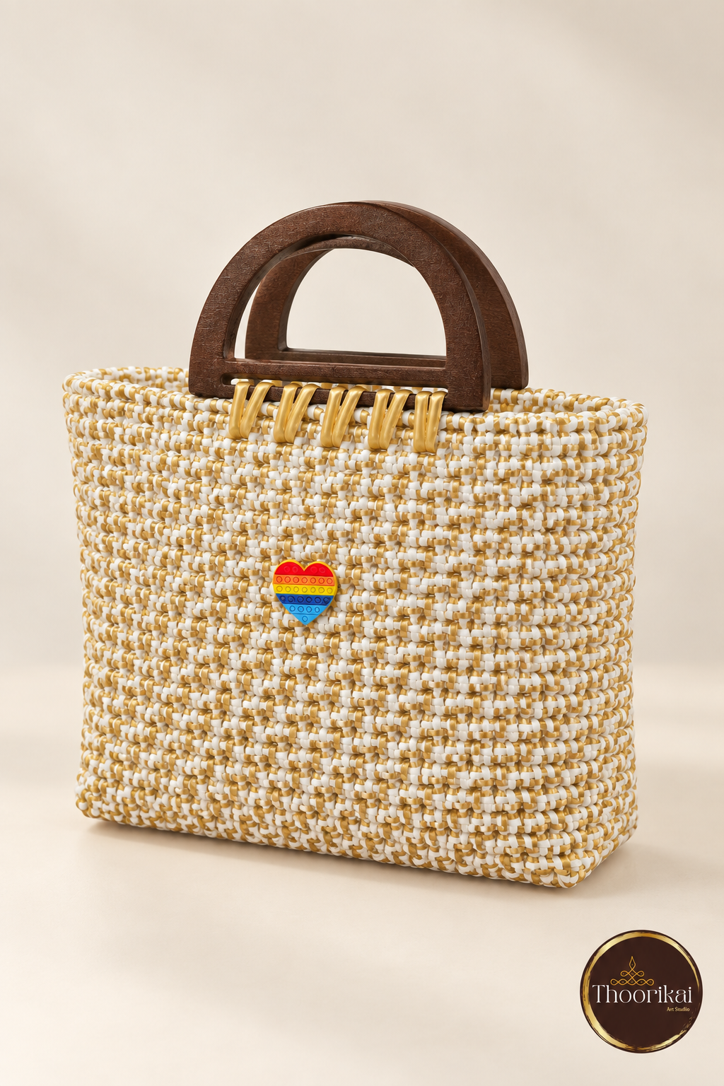 Elevated view of white-gold woven handbag with wooden D handles