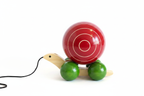 Channapatna pull-along snail toy styled product photo