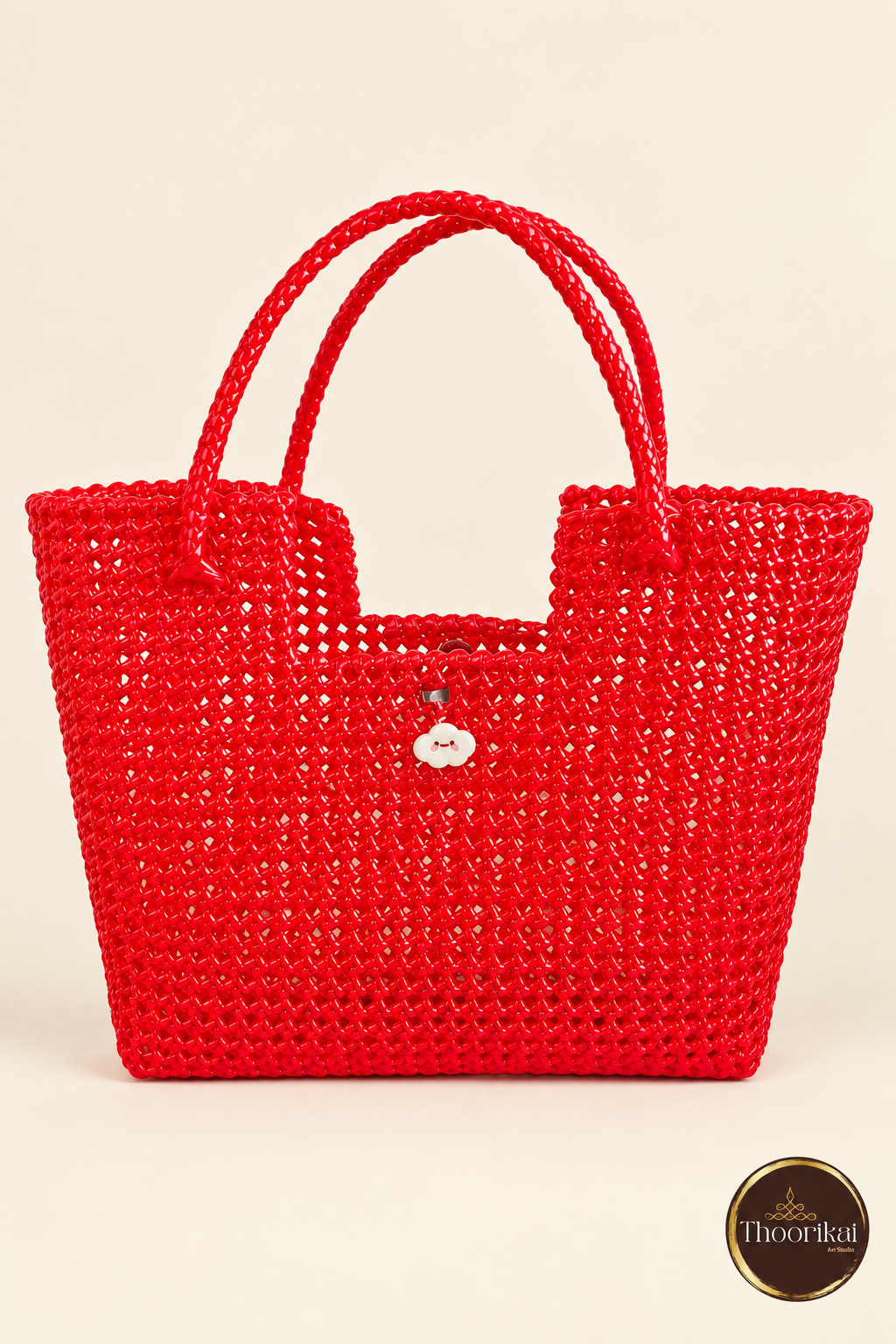 Front view of red handwoven tote bag with button detail