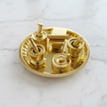 Brass puja thali set front-left angle on white marble