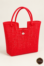 Three-quarter view of red handwoven tote bag