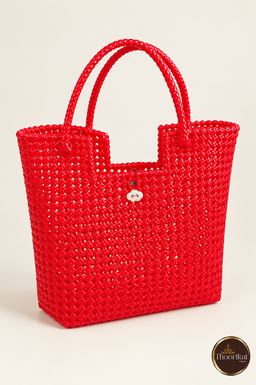 Three-quarter view of red handwoven tote bag