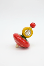 Channapatna wooden spinning top styled product photo