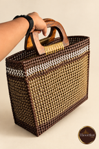 Hand-held angled side view of brown-gold market bag
