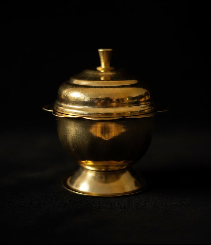 Kumkuma Bharani brass box on black background