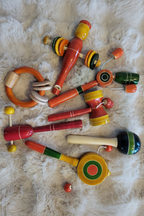Channapatna wooden baby toy set lifestyle photo on fur rug