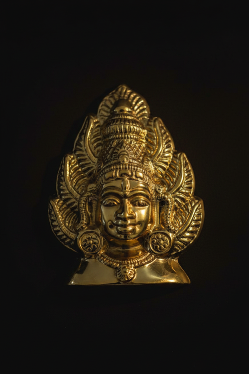 Murugan Mukham brass face mask on black background