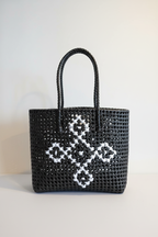 Black woven tote bag front view styled product photo