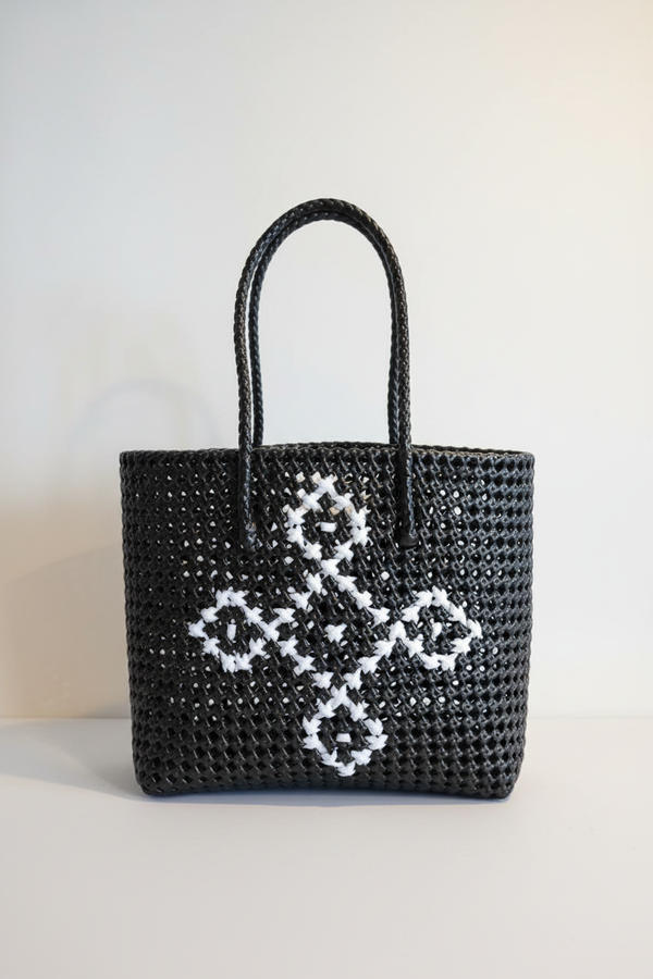 Black woven tote bag front view styled product photo