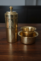 Brass filter coffee maker set moody dark wood lifestyle shot