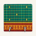 Green grid key holder with gold motifs and ornamental border