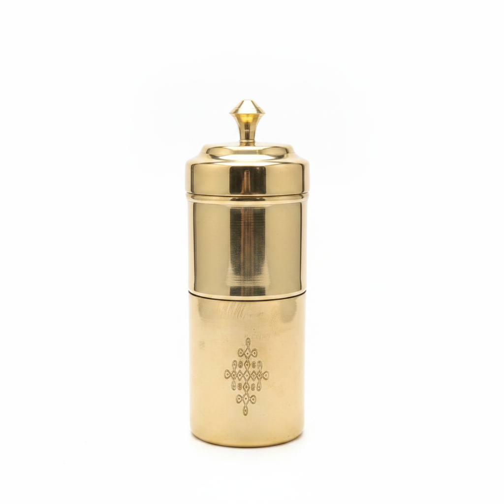 Handcrafted brass filter coffee maker on white background
