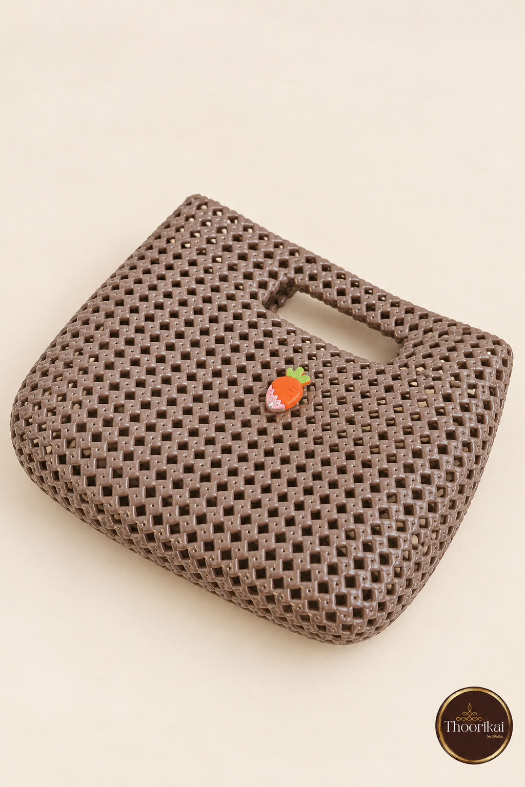 Elevated flat view of taupe woven cut-out mini handbag
