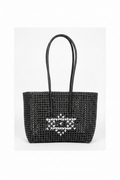 Black woven tote bag with heart motif front view styled product photo