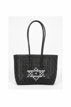 Black woven tote bag with heart motif front view styled product photo