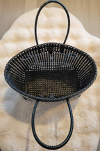 Black woven tote bag flat lay lifestyle product photo