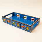 Blue hand-painted wooden bird tray, three-quarter studio view