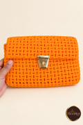Front view of orange handwoven clutch with gold-tone clasp
